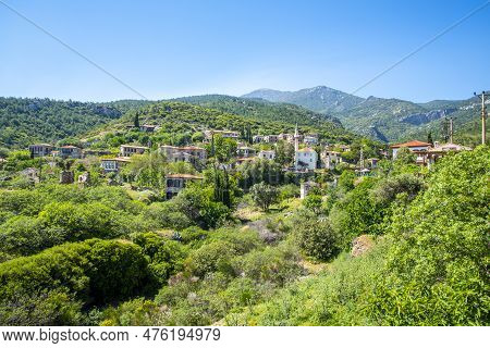 The Landscape Of Doganbay Village And Stone House On A Summer And Sunny Day.