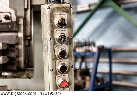 A Worker Is Operating Remote Swtich To Control Overhead Crane At The Factory Warehouse. Industrial W