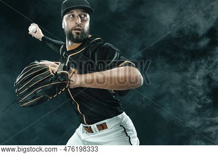 Baseball Player With Ball. Ballplayer On Black Background.