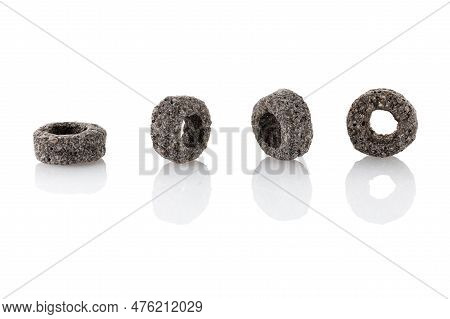 Heap Of Black Cereal Rings Isolated On White Background, Delicious And Useful Rings Breakfast Cereal