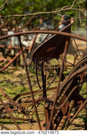 Vintage Plowing Machine. Old Farm Machinery. Old Rusty Plow. Nobody, Selective Focus.