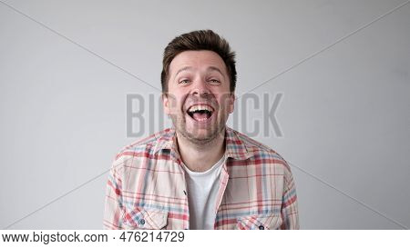 European Funny Young Man Is Laughing Loudly. Positive Emotion