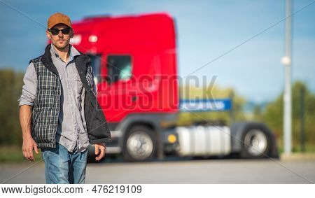 Necessary Truck Stop Break . Caucasian Semi Truck Driver Taking Short Walk Along Parking Lot. Transp