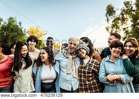 Happy Multigenerational People Having Fun Together In A Public Park - Diversity Concept