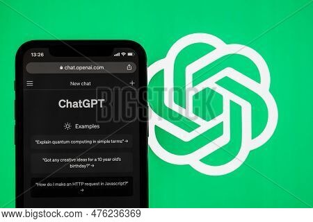 Webpage Of Chatgpt, A Chatbot Prototype On The Openai Website On A Smartphone. Against The Backgroun