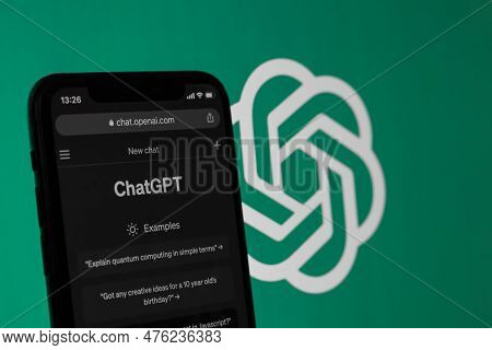 Webpage Of Chatgpt, A Chatbot Prototype On The Openai Website On A Smartphone. Against The Backgroun