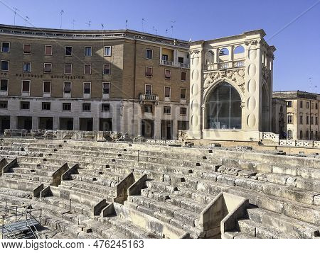 Lecce, Italy - October 25, 2016: Amphitheatre In Lecce, Italy And Instituto Nazionale Assicurazioni 