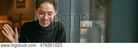 Smiling Woman Freelance Talking With Client Via Video Call And Discuss Project Sitting In Cafe