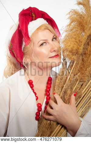 Portrait Of Heerful Funny Adult Mature Woman Solokha With Sheaf Of Ears. Female Model In Clothes Of 