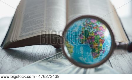 Globe With Holy Bible For Mission, Mission Christian Idea. Bible And Book On Wooden Table, Christian