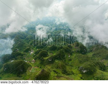 Aerial View Of Mountain Peaks And Hills Covered With Green Vegetation And Mist. Osmena Peak. Mountai
