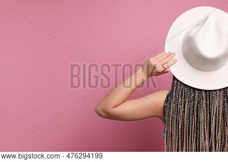Woman With African Braids On Pink Background, Back View. Space For Text