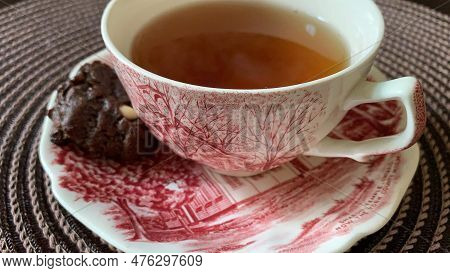 Tea Time With Beautiful Vintage Teacup And A Cookie