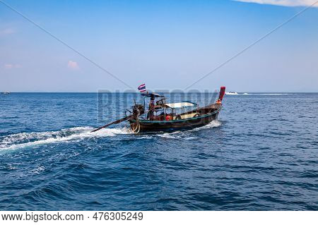 Old Traditional Thai Motorboat Made Of Wood For Fishing And Tourists On Excursions In The Andaman Se