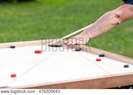 Men Playing Novuss Game. Novuss Is A National Sport In Latvia Similar To Pocket Billiards Or Pool.