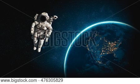 Astronaut Spaceman Do Spacewalk While Working For Space Station In Outer Space . Astronaut Wear Full