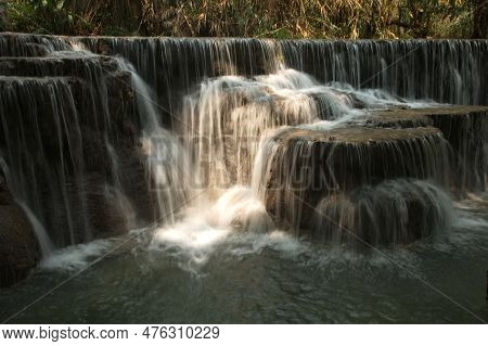 Tat Kuang Si Waterfalls Is A Limestone Waterfall Emerald Green Inside The Waterfall, There Is An Ord