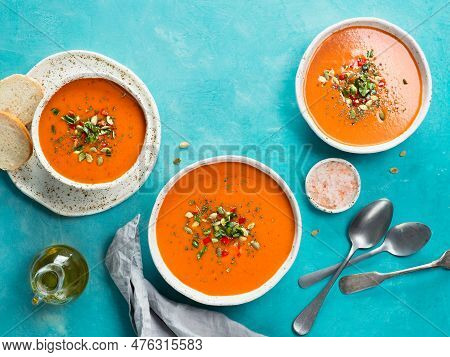Gaspacho Soup On Blue Tabletop. Three Bowls Of Traditional Spanish Cold Soup Puree Gaspacho Or Gazpa
