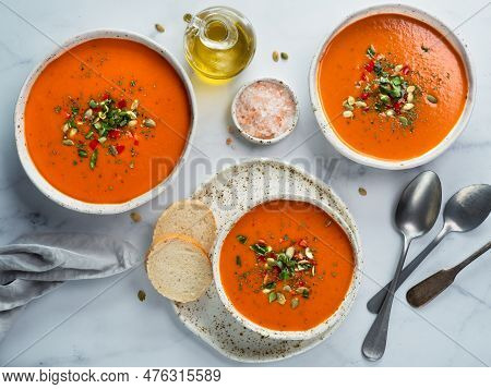 Gaspacho Soup On White Marble Tabletop. Three Bowls Of Traditional Spanish Cold Soup Puree Gaspacho 