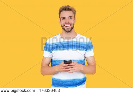 Man Smile Uses Phone To Make Effective Communication. Man Has Phone Communication. Digital Communica