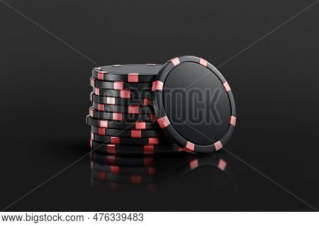 A Stack Of Black Plastic Chips With A Red Stripe For Playing In A Casino