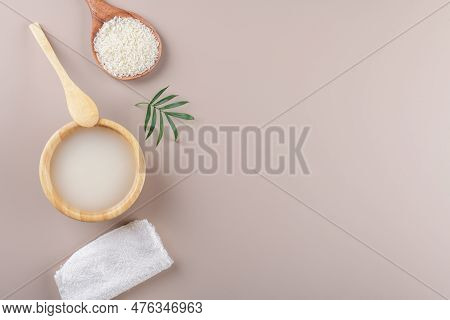 Homemade Cosmetic Rice Water With Ingredients On Beige Background, Healthy Beauty Hair Treatment Ing