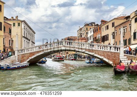 Venice, Italy - April 06 2019: The Guglie Bridge (italian: Ponte Delle Guglie) Is A Historic Footbri