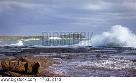 A Huge Wave Breaking Along The Edge Of A Rock Platform On The East Coast Of Australia During Stormy 