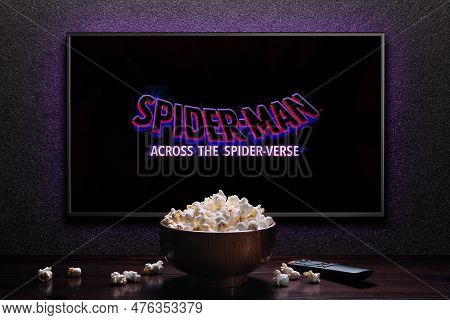Tv Screen Playing Spider-man Across The Spider-verse Trailer Or Movie. Tv With Remote Control And Po