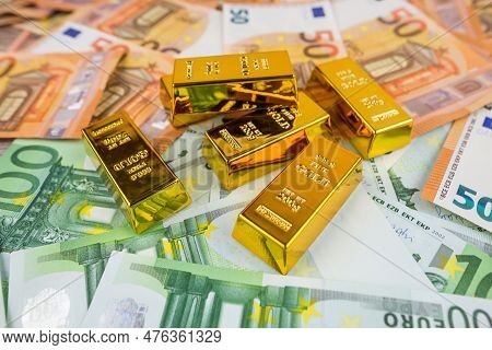 Euro Banknotes And Gold Bars. Gold Bars On Money