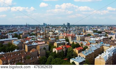 Riga Cityscape Spring Aerial Top View Video, Town, Latvia. Sunny Day Building Rooftops. Riga Skyline