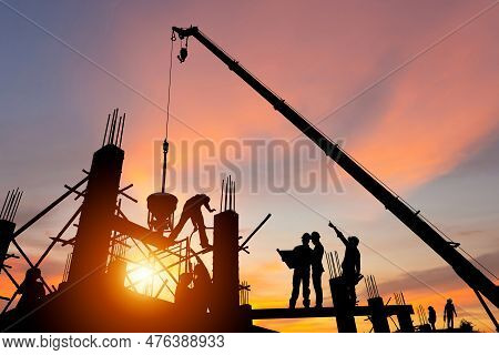 Silhouette Of Engineer And Worker Team Checking Project At Building Site Background, Construction Si