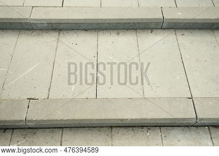 Grey Tiles For The Steps, With A Bardur Stone.. Gray Background And A Place For The Inscription.