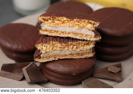 Tasty Choco Pies And Pieces Of Chocolate On Plate, Closeup