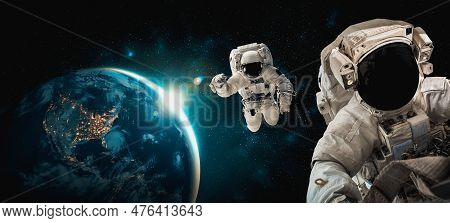 Astronaut Spaceman Do Spacewalk While Working For Space Station In Outer Space . Astronaut Wear Full