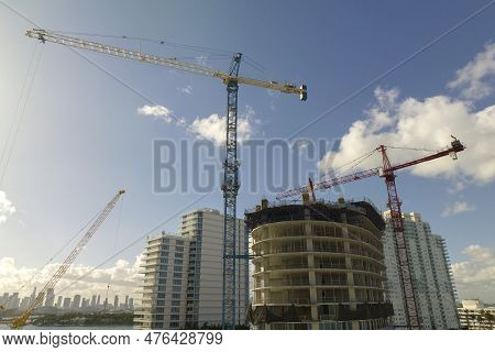 New Construction Site Of Developing Residense In American Urban Area. Industrial Tower Lifting Crane