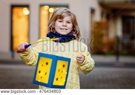 Little Preschool Kid Girl Holding Selfmade Traditional Lanterns With Candle For St. Martin Processio