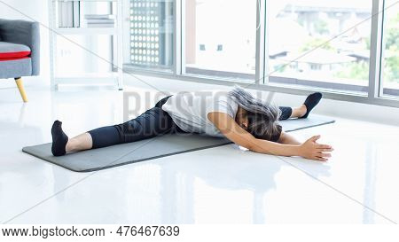 Asian Beautiful Healthy Fit Slim Sexy Female Sporty Athlete Model In Sportswear And Leggings Sitting