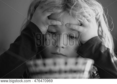 Portrait Of Sad Child Having Breakfast At Home. Portrait Of Sweet Little Kid Boy With Blonde Hair Ea