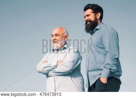 Handsome Senior Men In Blue Shirt. Portrait Of Two Bearded Men. Grandfather Ageing. Male Multi Gener