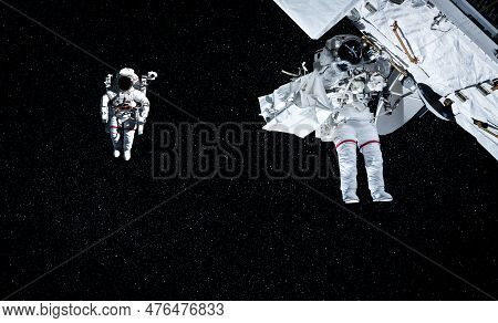 Astronaut Spaceman Do Spacewalk While Working For Space Station In Outer Space . Astronaut Wear Full