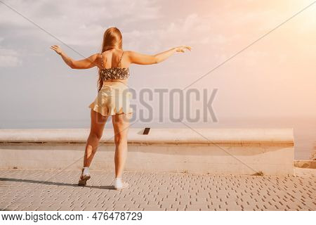 Woman Summer Dance. Silhouette Of A Happy Woman Who Dances, Spins And Raises Her Hands To The Sky. A