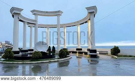 Gagra, Abkhazia, Georgia - 12 April, 2023: View On Modern Colonnade At Rainy Dusk On The Seashore At