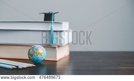 Graduation Cap With Earth Globe. Concept Of Global Business Study, Abroad Educational, Back To Schoo