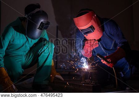 Metal Welding Steel Works Using Electric Arc Welding Machine To Weld Steel At Factory. Metalwork Man