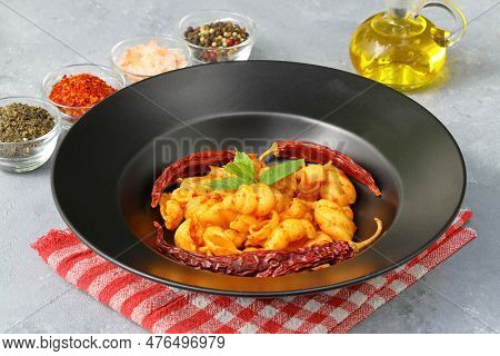 Gnocchetti Sardi Pasta In Tomato Sauce. Gray Background. Italian Food Concept