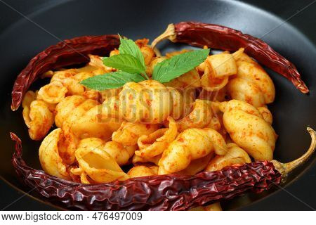 Gnocchetti Sardi Pasta In Tomato Sauce. Gray Background. Italian Food Concept