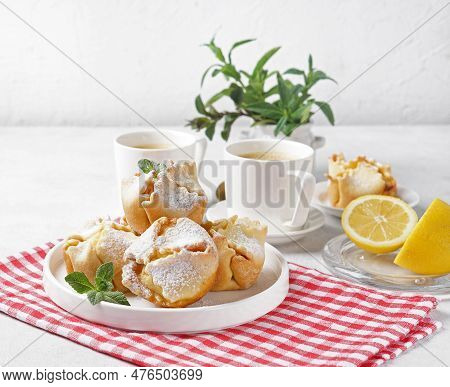 Soffioni - Traditional Ricotta Cheese And Lemon Cakes. Concept Of Sweet And Easter National Pastries