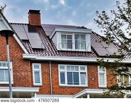 Voorburg, Netherlands - June 19 2022: Modern Dutch Home With Solar Panels On The Roof