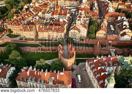 Old City In Warsaw With Red Roofs, Poland From Above. Travel Outdoor European Background With Wall A